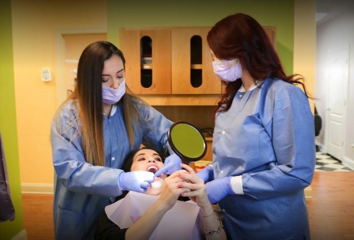 Staff Cleaning Patients Braces